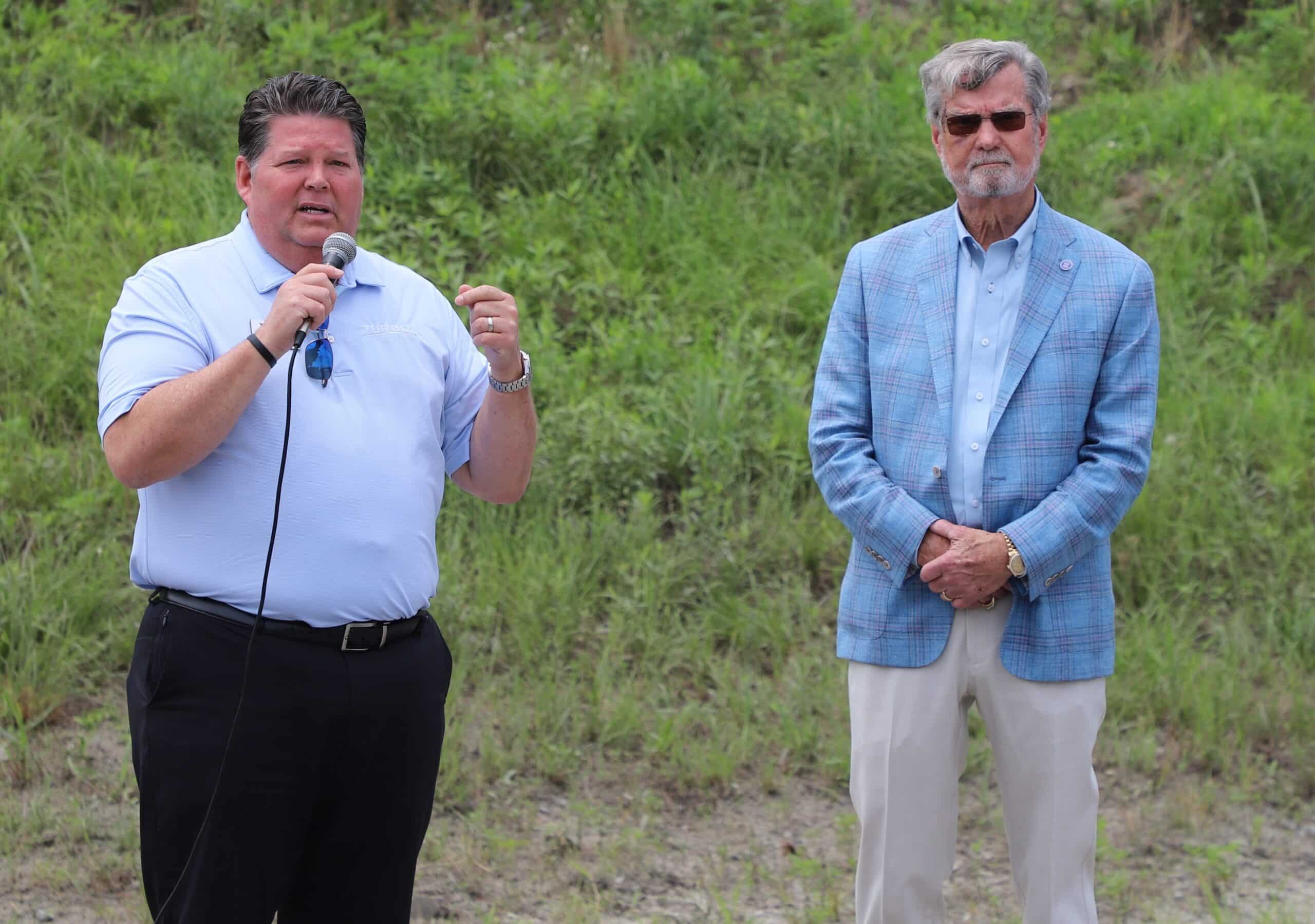 Turbo COO Chris Smith, left, and Syfan Logistics CEO Jim Syfan address the crowd at the new Savannah office open house.